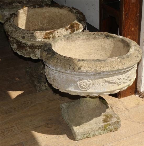Two reconstituted stone pedestal campana urn shape planters W.46cm approx.